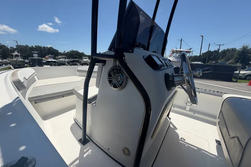 Slide: The Image of 2022 Key Largo 180 Center Console boat interior with steering wheel and seating. - 25