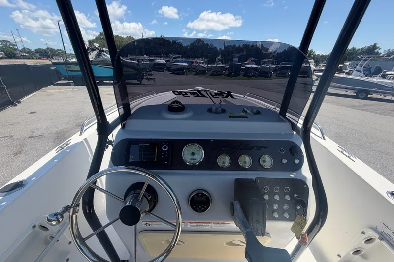 Slide: The Image of 2022 Key Largo 180 Center Console boat dashboard with steering wheel and gauges. - 16
