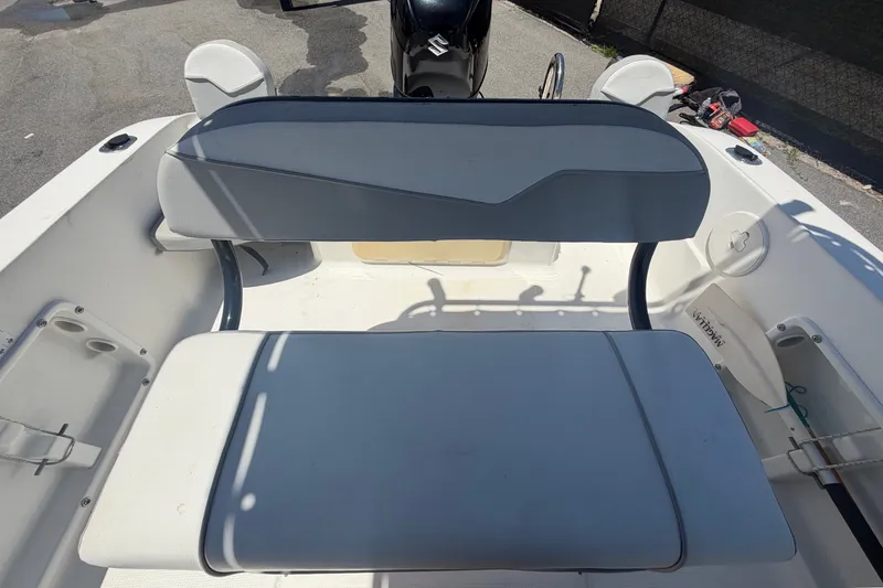 Slide: The Image of The 2022 Key Largo 180 Center Console features a cushioned bench seat at the rear. - 40