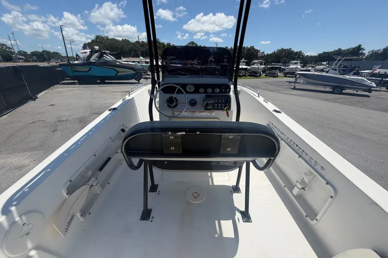 Slide: The Image of 2022 Key Largo 180 Center Console boat interior with steering wheel and controls. - 12