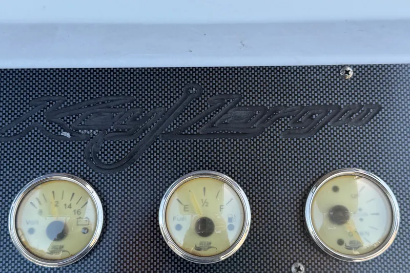 Slide: The Image of Dashboard of 2022 Key Largo 180 Center Console with gauges and logo. - 19