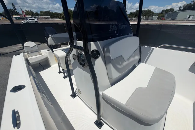 Slide: The Image of 2022 Key Largo 180 Center Console boat interior with seating and steering console. - 38