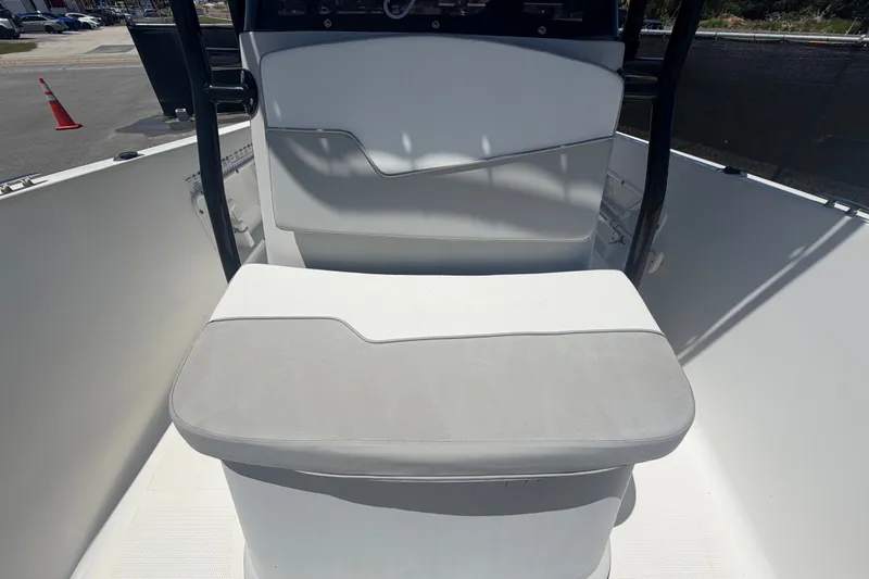 Slide: The Image of 2022 Key Largo 180 Center Console boat interior with cushioned seating and console view. - 35