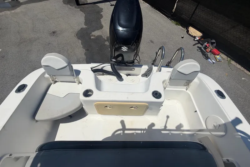 Slide: The Image of 2022 Key Largo 180 Center Console boat interior with seating and motor. - 43