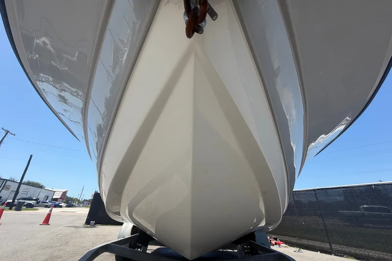 Slide: The Image of 2022 Key Largo 180 Center Console boat hull on trailer, viewed from below. - 9