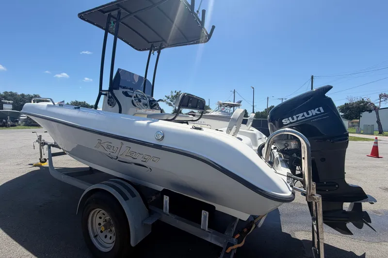 Slide: The Image of 2022 Key Largo 180 Center Console boat with Suzuki outboard motor on trailer. - 5