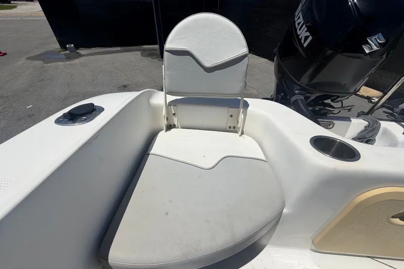 Slide: The Image of 2022 Key Largo 180 Center Console boat seat and Suzuki engine detail. - 44