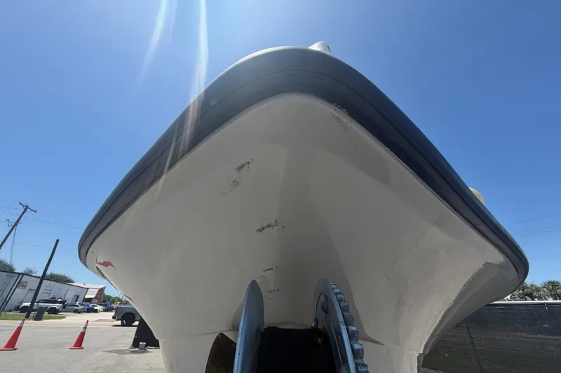 Slide: The Image of 2022 Key Largo 180 Center Console boat viewed from below against clear blue sky. - 8