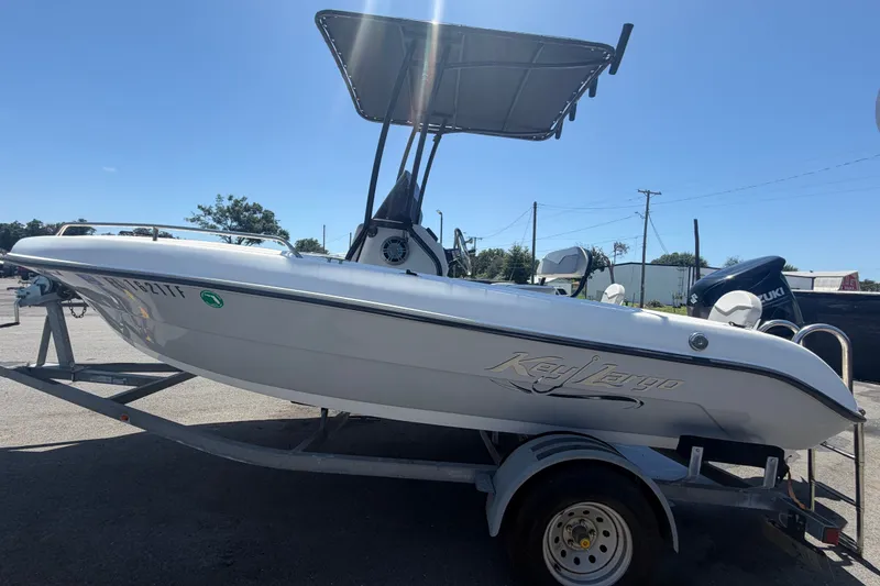 Slide: The Image of 2022 Key Largo 180 Center Console boat on trailer, sunny day. - 6