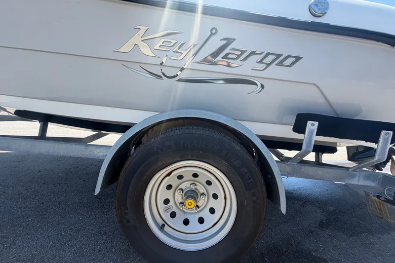 Slide: The Image of 2022 Key Largo 180 Center Console boat on trailer, close-up view. - 52