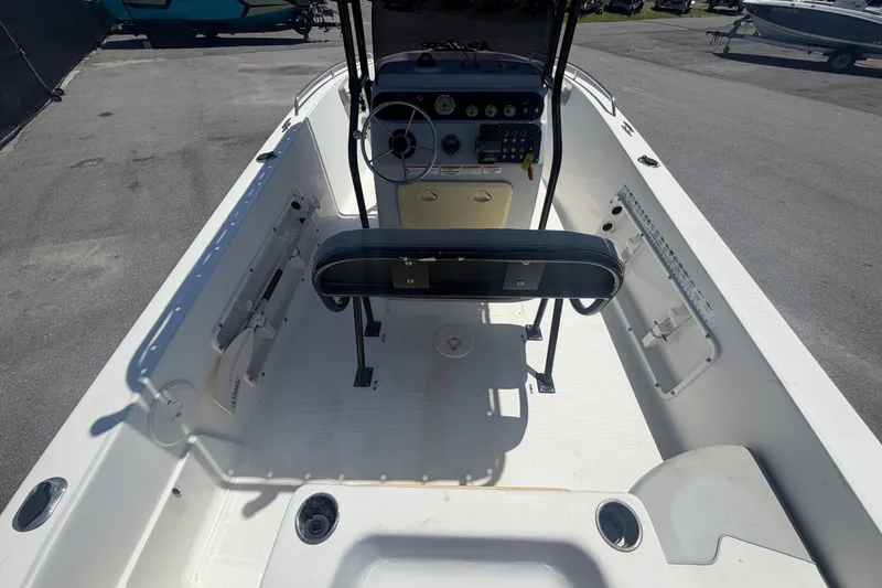 Slide: The Image of 2022 Key Largo 180 Center Console boat interior with steering wheel and seating. - 11