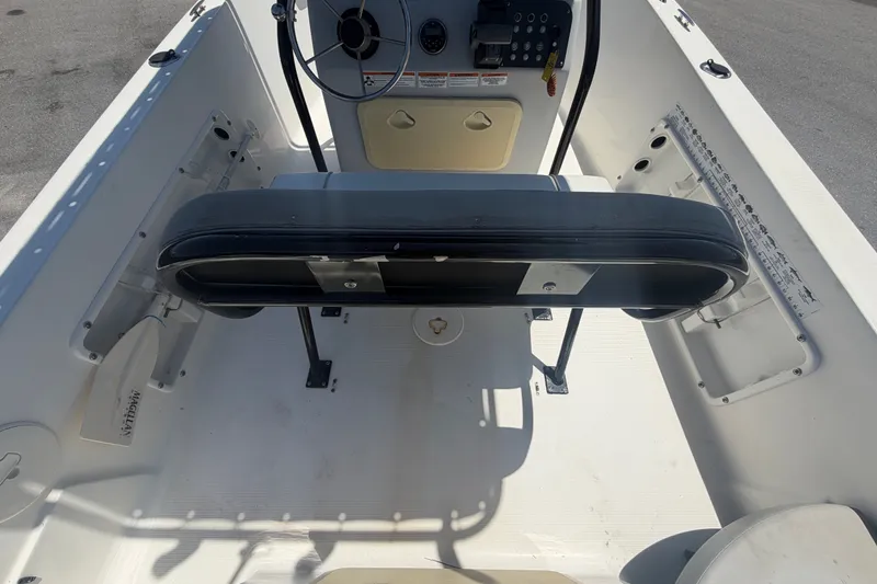 Slide: The Image of 2022 Key Largo 180 Center Console boat interior with steering wheel and seating. - 13
