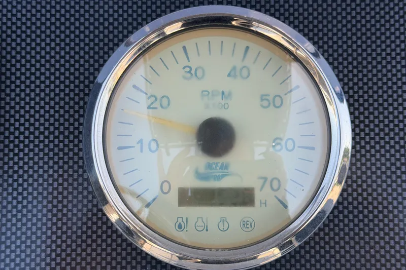 Slide: The Image of Tachometer of 2022 Key Largo 180 Center Console boat, displaying RPM on carbon fiber background. - 18