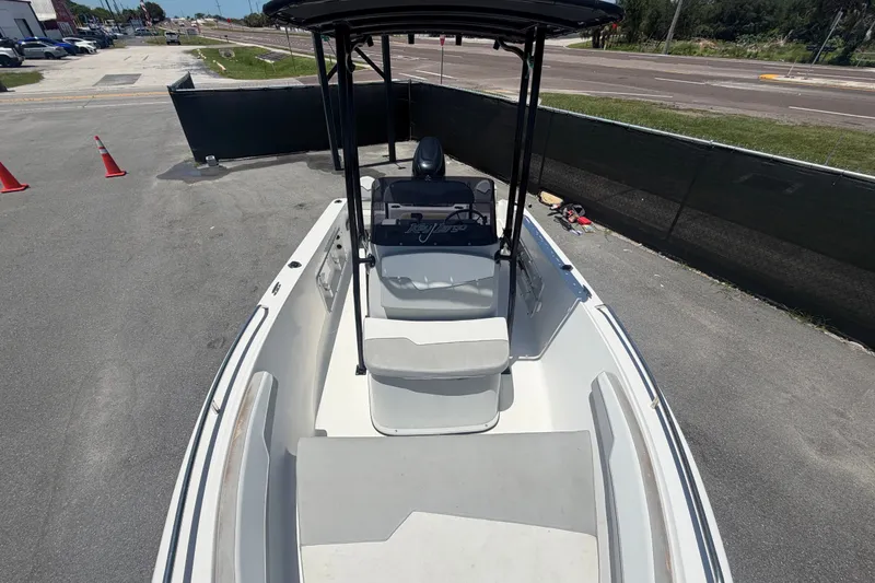 Slide: The Image of 2022 Key Largo 180 Center Console boat parked on pavement, viewed from above. - 32