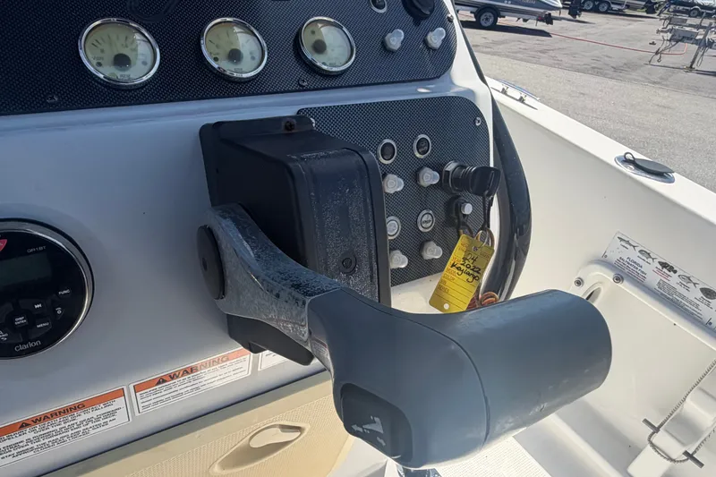 Slide: The Image of 2022 Key Largo 180 Center Console dashboard with controls and gauges. - 22