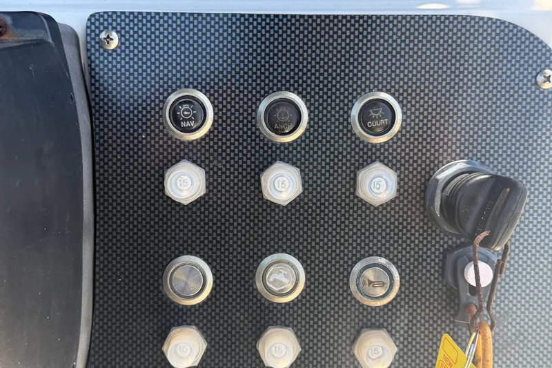 Slide: The Image of Control panel of 2022 Key Largo 180 Center Console boat with navigation switches. - 20