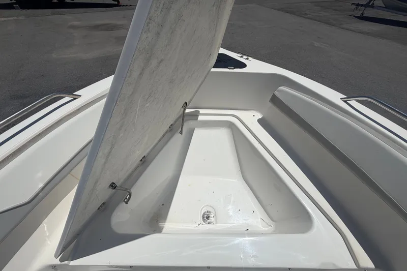 Slide: The Image of Open storage compartment on 2022 Key Largo 180 Center Console boat. - 29