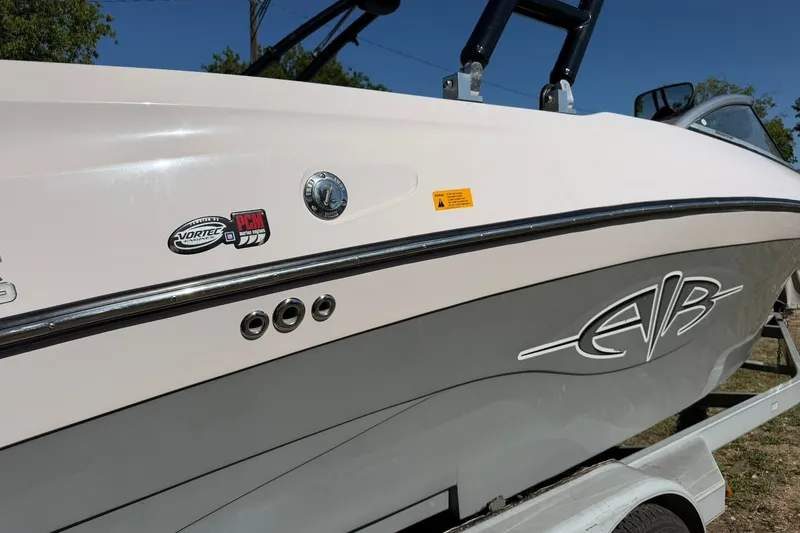 Slide: The Image of 2003 Nautique Air Nautique 226 boat side view with Vortec and PCM logos. - 14