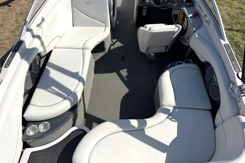 Slide: The Image of Interior of a 2003 Nautique Air Nautique 226 boat with white seating. - 25