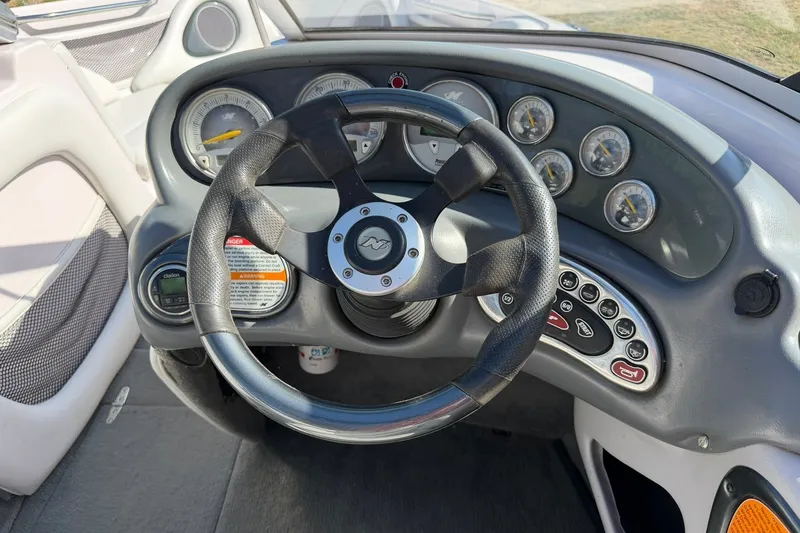 Slide: The Image of Steering wheel and dashboard of 2003 Nautique Air Nautique 226 boat. - 41