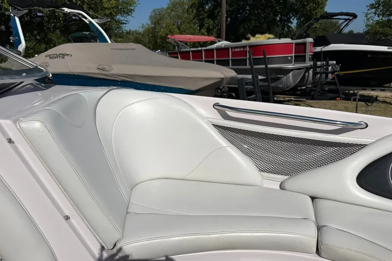 Slide: The Image of 2003 Nautique Air Nautique 226 boat interior with white seating and metal accents. - 47