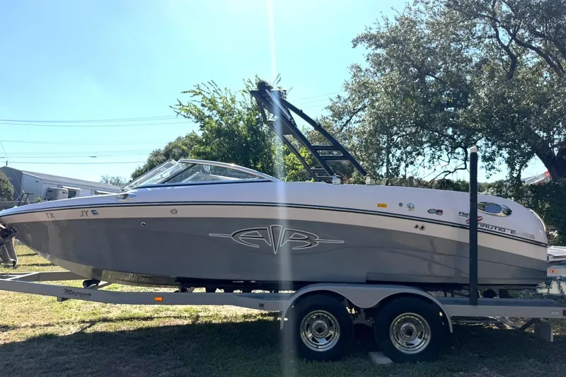 Slide: The Image of 2003 Nautique Air Nautique 226 boat on trailer, parked outdoors. - 15