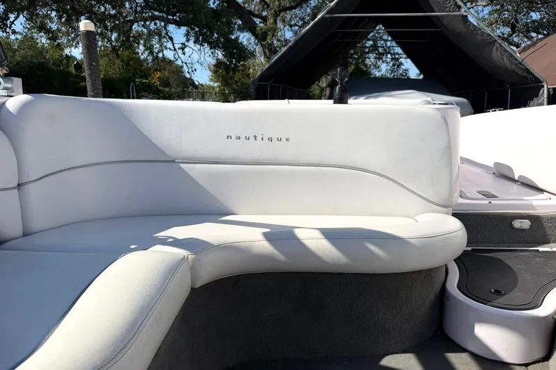 Slide: The Image of 2003 Nautique Air Nautique 226 boat interior with white seating and sleek design. - 31