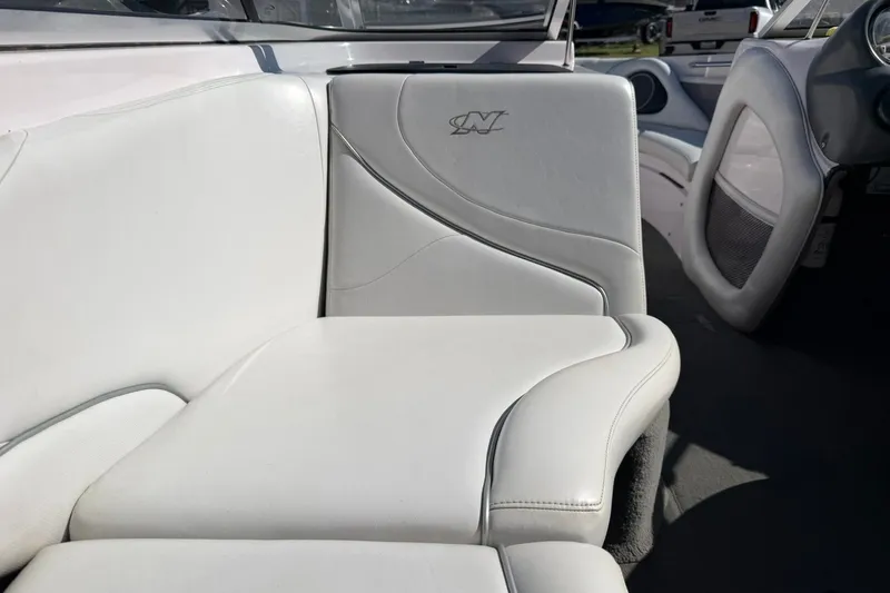 Slide: The Image of Interior of a 2003 Nautique Air Nautique 226 boat with white leather seating. - 34