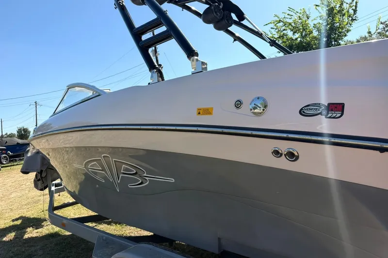 Slide: The Image of 2003 Nautique Air Nautique 226 boat on trailer, side view with logos and tower. - 18