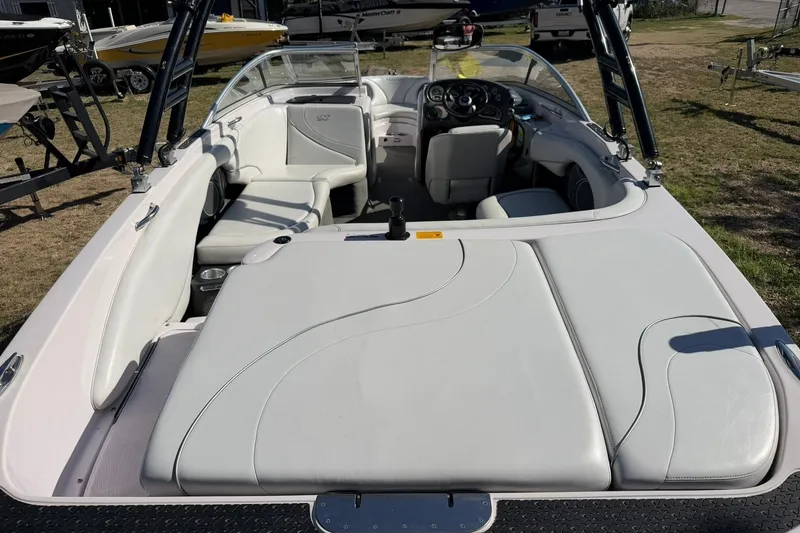 Slide: The Image of 2003 Nautique Air Nautique 226 boat interior with white seating and dashboard view. - 24