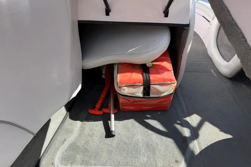 Slide: The Image of Interior of 2003 Nautique Air Nautique 226 boat with storage compartment and safety equipment. - 37
