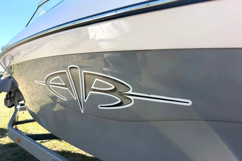 Slide: The Image of 2003 Nautique Air Nautique 226 boat side view with logo detail. - 19