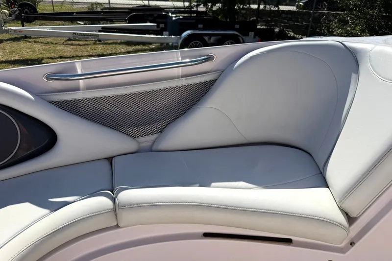 Slide: The Image of 2003 Nautique Air Nautique 226 boat interior with white cushioned seating and metal railing. - 46