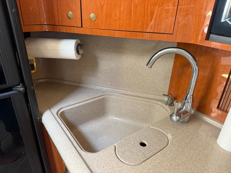 Slide: The Image of Galley with sink and faucet in a 2001 Sea Ray 380 Sundancer. - 36