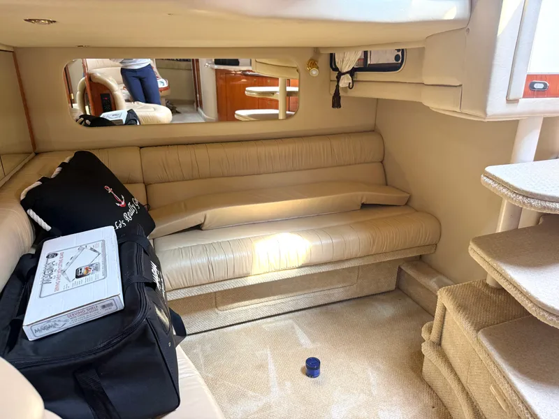 Slide: The Image of Interior of a 2001 Sea Ray 380 Sundancer with beige sofa and carpet. - 50