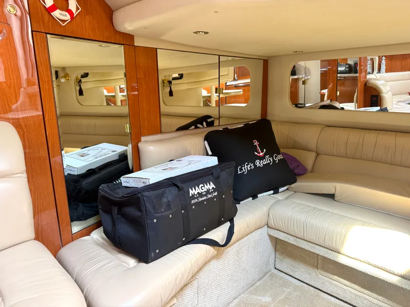Slide: The Image of Interior of a 2001 Sea Ray 380 Sundancer with beige leather seating and mirrors. - 49