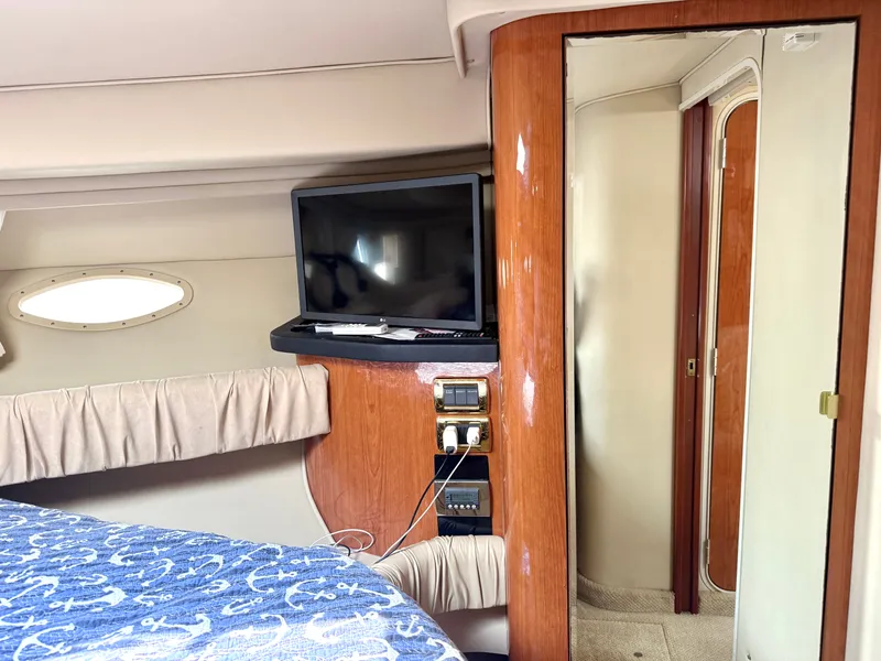 Slide: The Image of Interior of a 2001 Sea Ray 380 Sundancer with a TV and a mirror. - 46