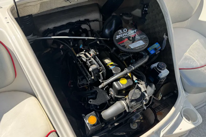 Slide: The Image of The engine compartment of a 2008 Sea Ray 175 Sport features a 3.0 Mercury engine. - 21