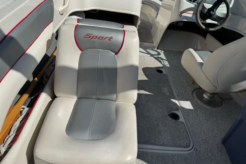 Slide: The Image of Interior of a 2008 Sea Ray 175 Sport boat, featuring seating and steering wheel. - 17