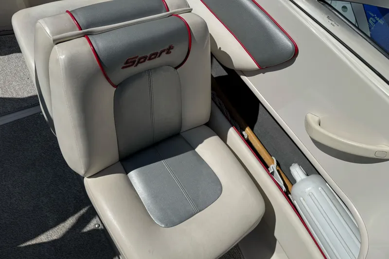 Slide: The Image of Interior of a 2008 Sea Ray 175 Sport boat with gray and red seating. - 14
