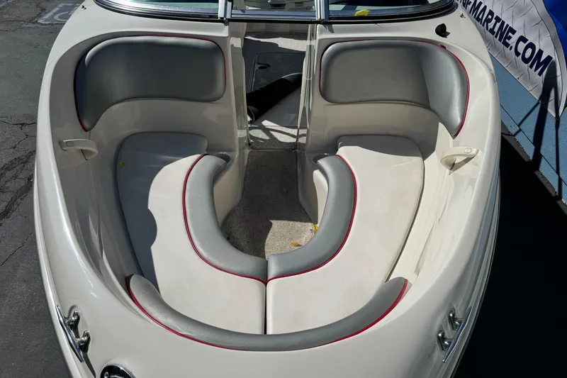 Slide: The Image of Interior view of a 2008 Sea Ray 175 Sport boat, featuring cushioned seating. - 8