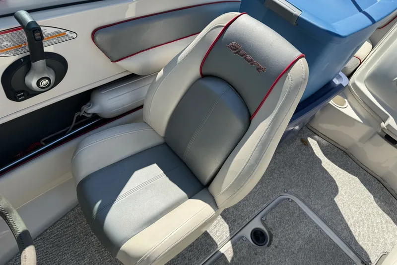 Slide: The Image of 2008 Sea Ray 175 Sport boat interior with gray and white seating. - 11