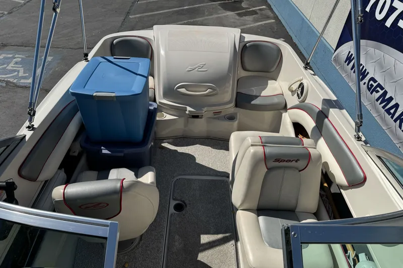 Slide: The Image of 2008 Sea Ray 175 Sport boat interior with seating and storage bins. - 9