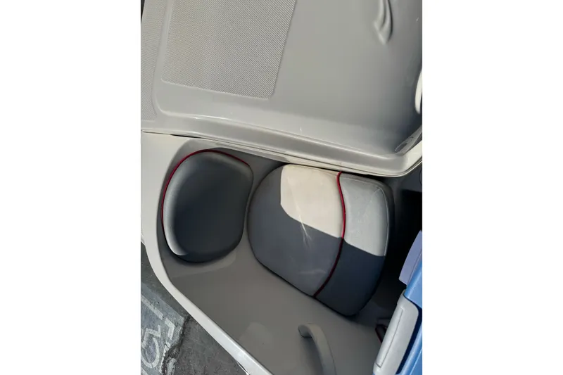 Slide: The Image of Interior seating of a 2008 Sea Ray 175 Sport boat, featuring gray and red accents. - 19