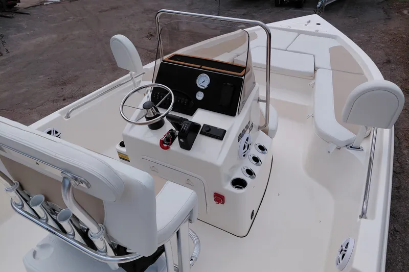 Slide: The Image of 2027 Bulls Bay 2200 XS boat interior with steering console and seating arrangement. - 33