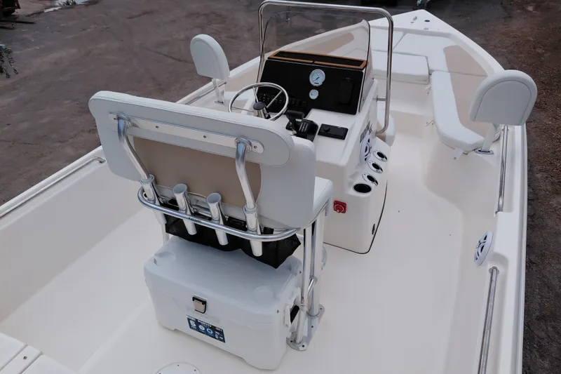 Slide: The Image of 2027 Bulls Bay 2200 XS boat interior with steering console and seating arrangement. - 31