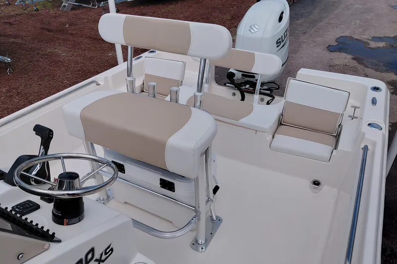 Slide: The Image of 2027 Bulls Bay 2200 XS boat interior with steering wheel and seating. - 25
