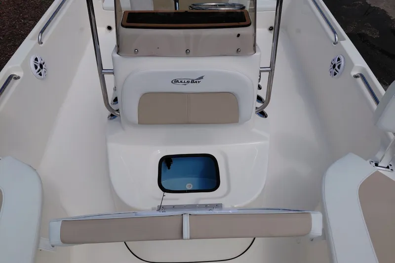 Slide: The Image of 2027 Bulls Bay 2200 XS boat interior with seating and storage compartments. - 16