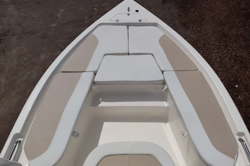 Slide: The Image of 2027 Bulls Bay 2200 XS boat interior with cushioned seating and sleek design. - 18