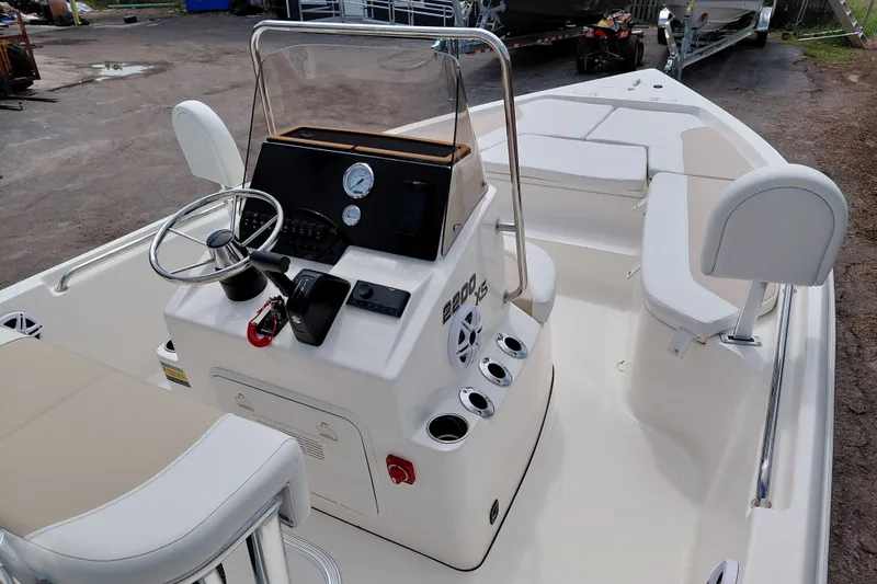 Slide: The Image of 2027 Bulls Bay 2200 XS boat interior with steering console and seating. - 22